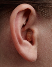 image of a person wearing a custom remote microphone hearing aid