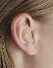 image of a person wearing an in the ear hearing aid